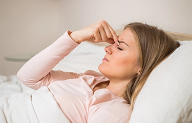 Woman suffering from a sinus headache